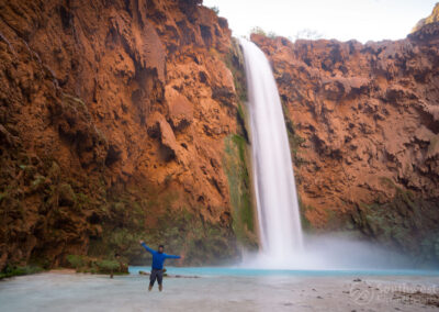 Posing in front of Mooney Falls from the side.