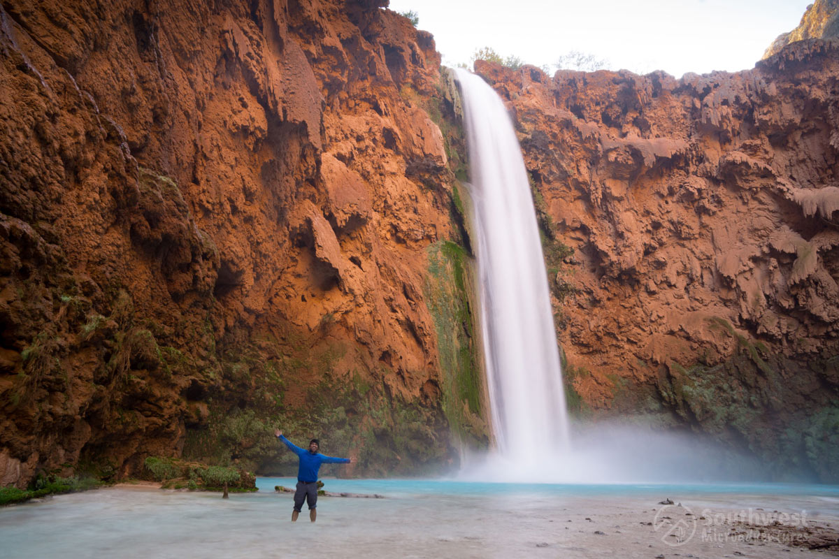 Posing in front of Mooney Falls from the side.